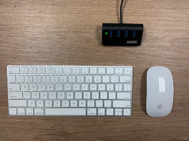 An image showing a keyboard, mouse, and USB hub on a table